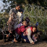 Syrians cross into Hungary at the border with Serbia, Aug. 27, 2015